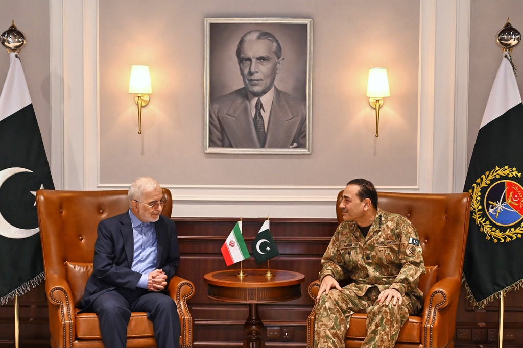 In this photo released by the Inter Services Public Relations, Iran's Interior Minister Eskandar Momeni, left, meets with Pakistan's Army Chief Field Marshal Asim Munir in Rawalpindi, Pakistan, Tuesday, July 21, 2026. (Inter Services Public Relations via AP)