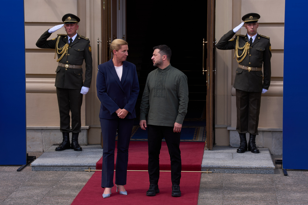 Danish Prime Minister Mette Frederiksen, left, is welcomed by President Volodymyr Zelenskyy during a Ukrainian and Nordic-Baltic countries summit in Kyiv, Sunday, Aug. 23, 2026. (AP Photo/Francisco Seco)