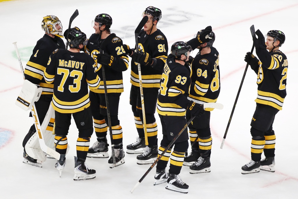 The Boston Bruins celebrate after defeating the Buffalo Sabres in an NHL hockey game, Saturday, Oct. 11, 2025, in Boston. (AP Photo/Michael Dwyer)