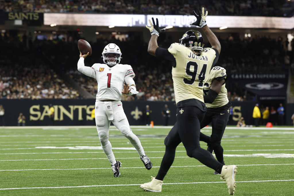 Arizona Cardinals quarterback Kyler Murray (1) throws against New Orleans Saints defensive ends Cameron Jordan (94) and Carl Granderson during the first half of an NFL football game Sunday, Sept. 7, 2025, in New Orleans. (AP Photo/Butch Dill)