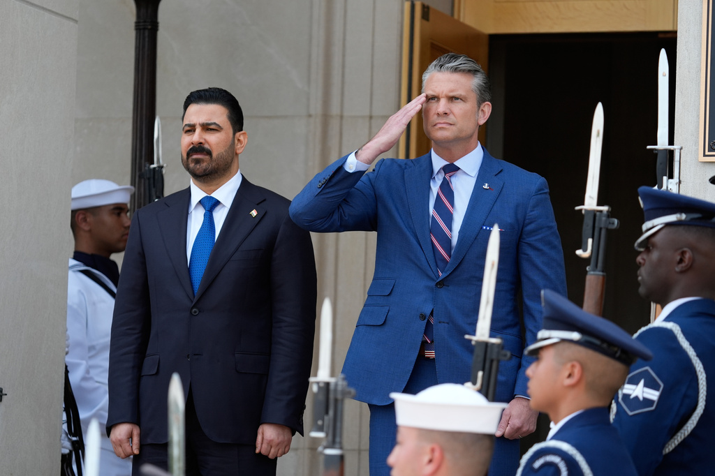 Secretary of Defense Pete Hegseth, right, welcomes Iraqi Prime Minister Ali al-Zaidi, to the Pentagon, during a ceremony, Tuesday, July 14, 2026, in Washington. (AP Photo/Manuel Balce Ceneta)