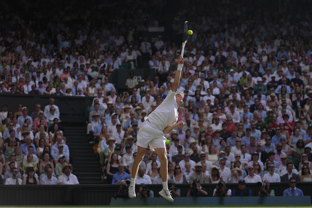 Jannik Sinner of Italy serves to Novak Djokovic of Serbia in their men's singles semifinal match at the Wimbledon Tennis Championships in London, Friday, July 10, 2026. (AP Photo/Brian Inganga)