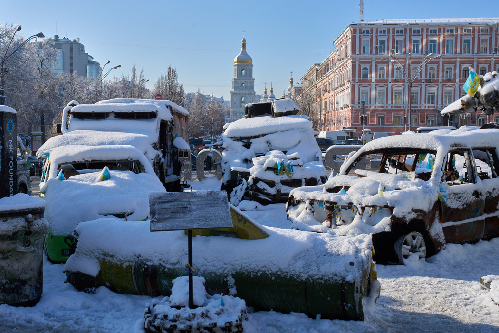 Snow covered, damaged Russian military vehicles are on display in downtown Kyiv, Ukraine, Friday, Jan. 16, 2026. (AP Photo/Efrem Lukatsky)