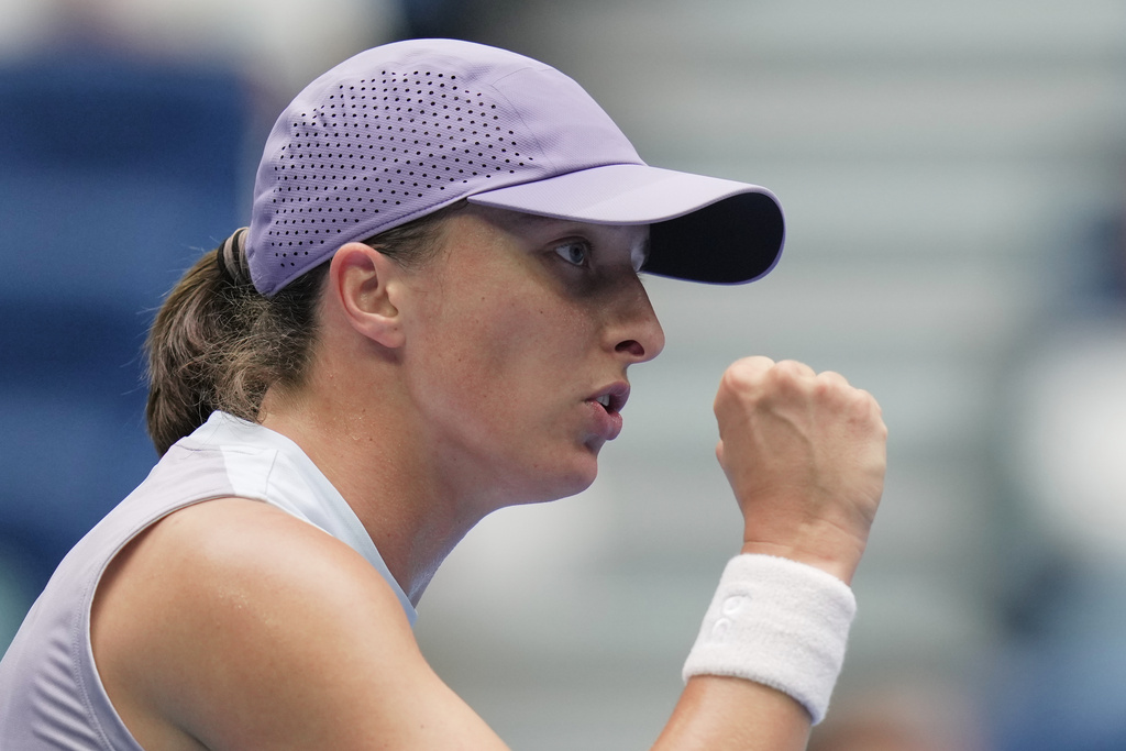 Fans of Iga Swiatek, of Poland reacts after scoring a point against Yuan Yue, of China during the women's singles match for the China Open tennis tournament, at the National Tennis Center, in Beijing, Saturday, Sept. 27, 2025. (AP Photo/Andy Wong)