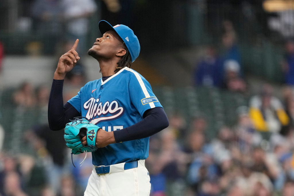 Milwaukee Brewers' Abner Uribe gestures as he walks to the dugout during the seventh inning of a baseball game against the Washington Nationals, Sunday, April 12, 2026, in Milwaukee. (AP Photo/Aaron Gash)