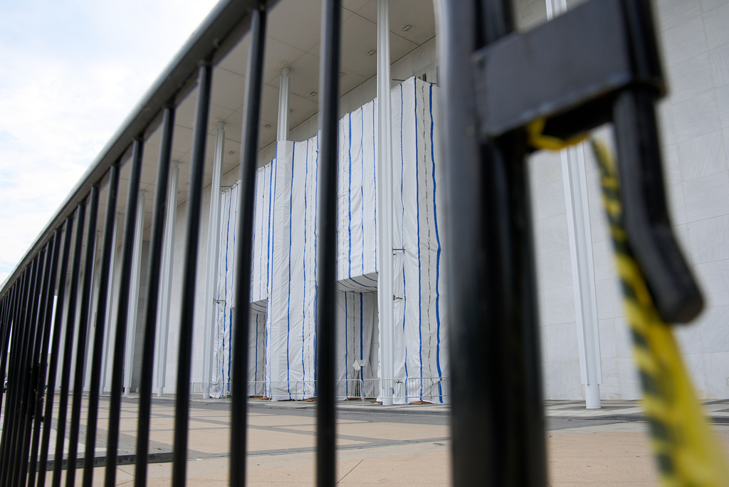 The Kennedy Center, which has been fenced off and closed to the public, is seen through a fence, Thursday, Sept. 17, 2026, in Washington. (AP Photo/Jacquelyn Martin)