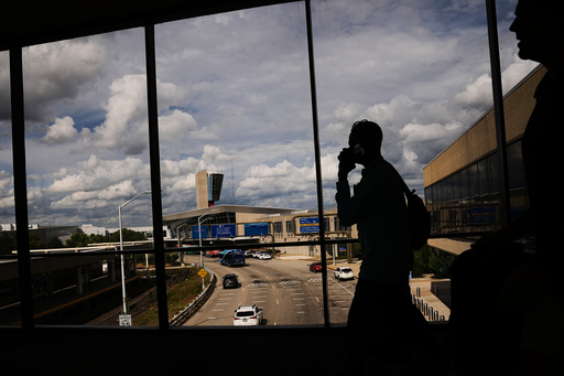 Passengers walk from a terminal at Philadelphia International Airport in Philadelphia, Tuesday, Oct. 7, 2025. (AP Photo/Matt Rourke) Passengers walk from a terminal at Philadelphia International Airport in Philadelphia, Tuesday, Oct. 7, 2025. (AP Photo/Matt Rourke)
