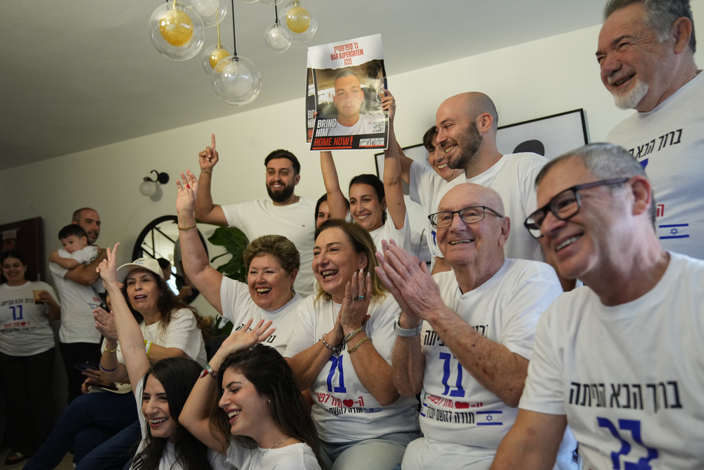 Family and friends of Israeli hostage Bar Kupershtein celebrate as they await the release of Kupershtein and other hostages from Hamas captivity in Gaza, in Holon, Israel, Monday, Oct. 13, 2025. (AP Photo/Francisco Seco)