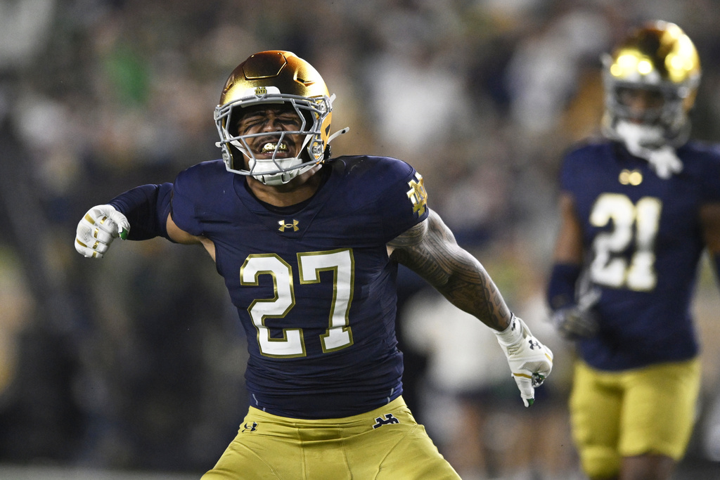 Notre Dame's Kyngstonn Viliamu-Asa (27) celebrates after tackling Texas A&M running back Rueben Owens II during the first quarter of an NCAA football game Saturday, Sept. 13, 2025, in South Bend, Ind. (AP Photo/Paul Beaty)