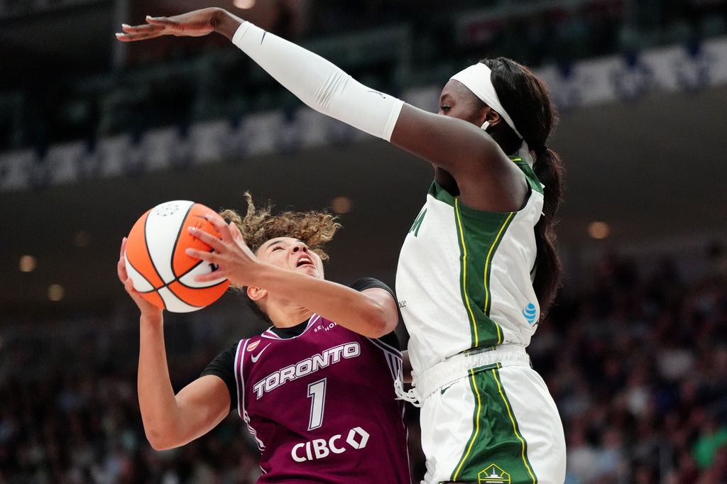 Toronto Tempo guard Kiki Rice (1) gets fouled by Seattle Storm centre Awa Fam (11) during the second half of a WNBA basketball game in Toronto, Saturday, May 30, 2026. (Frank Gunn/The Canadian Press via AP)
