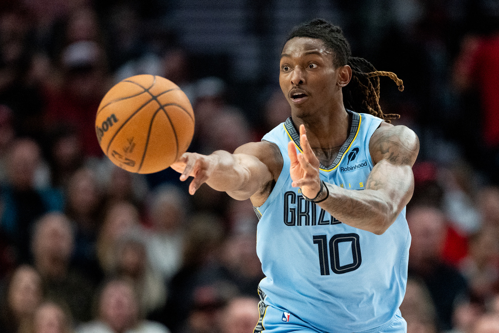 Memphis Grizzlies guard Javon Small (10) passes the ball during the first half of an NBA basketball game against the Portland Trail Blazers on Saturday, Feb. 7, 2026, in Portland, Ore. (AP Photo/Ali Gradischer)