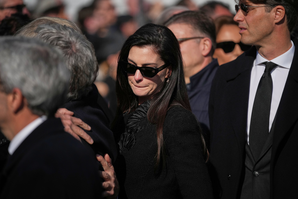 Anne Hathaway leaves after attending the funeral of fashion designer Valentino Garavani at the St. Mary of Angels Basilica, in Rome, Friday, Jan. 23, 2026. (AP Photo/Andrew Medichini)