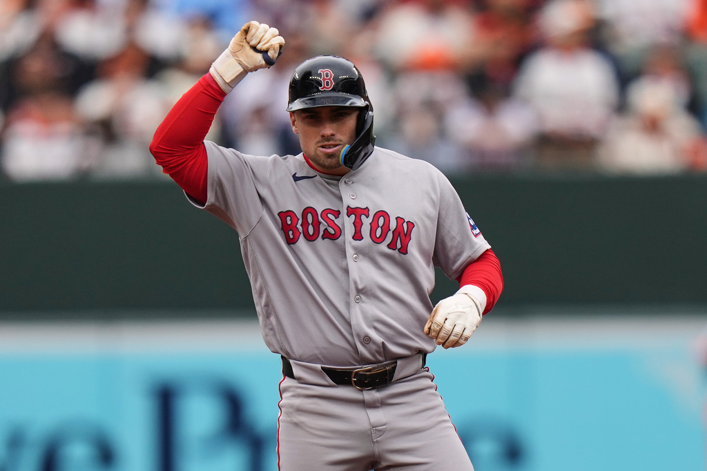 Boston Red Sox' Caleb Durbin celebrates after hitting an RBI double during the second inning of a baseball game against the Baltimore Orioles, Saturday, April 25, 2026, in Baltimore. (AP Photo/Stephanie Scarbrough)