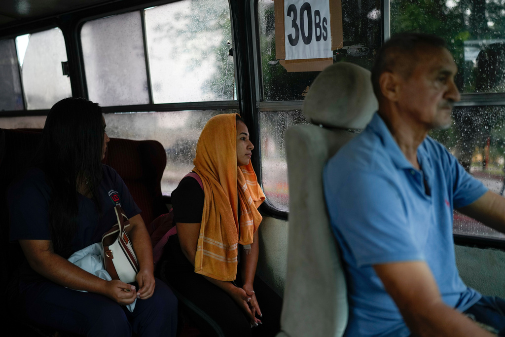 Gabriela Villanueva commutes to her home in Acarigua, Venezuela, June 12, 2025. She and her husband returned after traveling by land from Chile to Mexico, where they decided to turn back following the Trump administration's decision to close the border to asylum seekers. (AP Photo/Matias Delacroix)