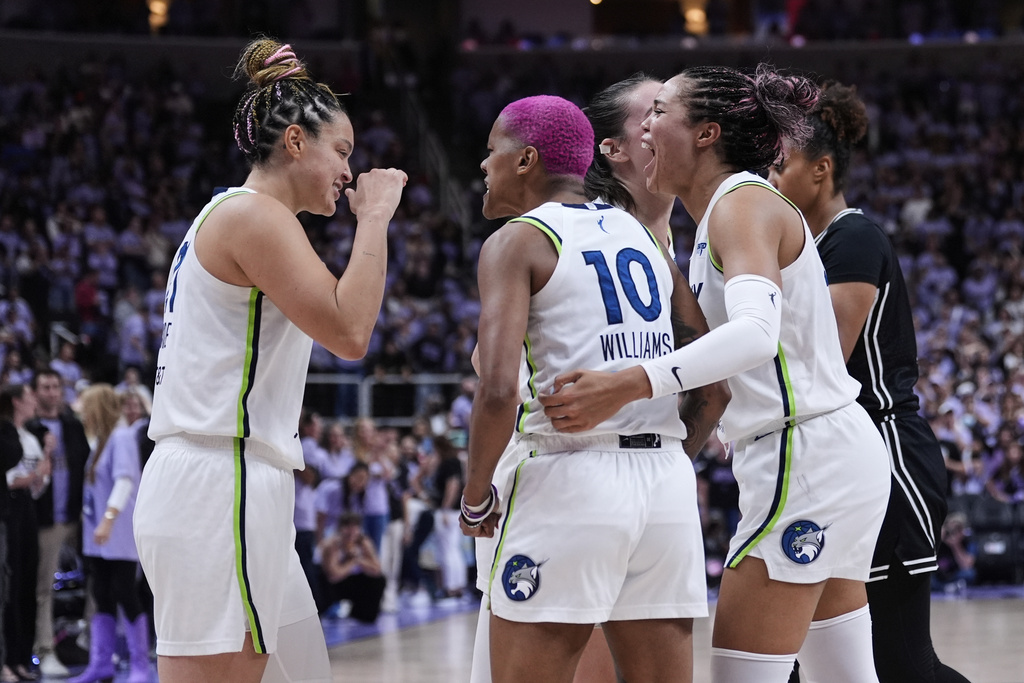 From left, Minnesota Lynx's Kayla McBride, Courtney Williams and Napheesa Collier celebrate after the team's victory over the Golden State Valkyries in the first round of the WNBA basketball playoffs Wednesday, Sept. 17, 2025, in San Jose, Calif. (AP Photo/Godofredo A. Vásquez)