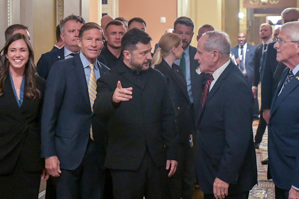 FILE - Ukraine's President Volodymyr Zelenskyy, center, is joined by from left: Sen. Katie Britt, R-Ala., Sen. Richard Blumenthal, D-Conn., Sen. James Risch, R-Idaho, and Sen. Roger Wicker, R-Miss., as he arrives at the U.S. Capitol for a meeting of bipartisan leaders of the Lindsey O. Graham Sanctioning Russia and Iran Act of 2026, July 28, 2026, in Washington. (AP Photo/Rod Lamkey, Jr., File)