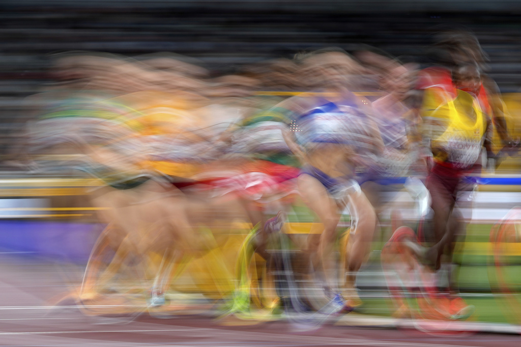 Athletes race in a women's 5,000 meters heat at the World Athletics Championships in Tokyo, Thursday, Sept. 18, 2025. (AP Photo/Petr David Josek)