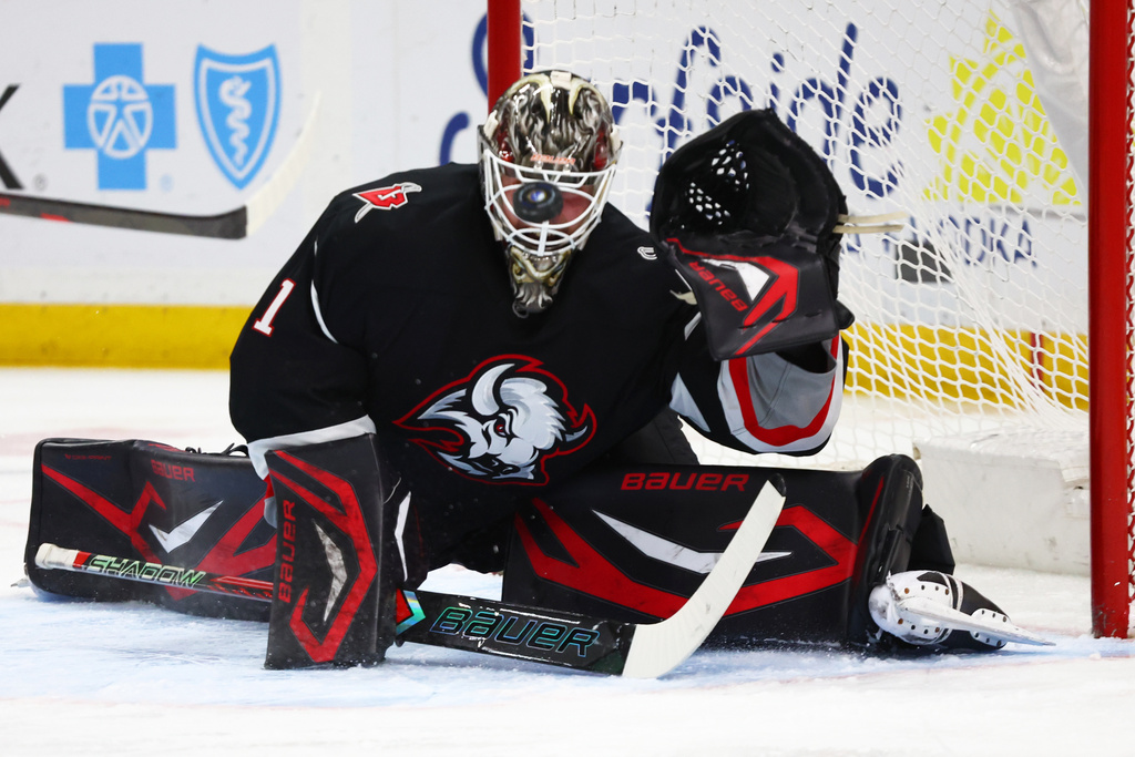 Buffalo Sabres goaltender Ukko-Pekka Luukkonen slides across the crease to make a save during the second period of an NHL hockey game against the Washington Capitals, Thursday, March 12, 2026, in Buffalo, N.Y. (AP Photo/Jeffrey T. Barnes)