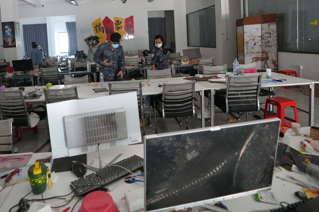 Thai soldiers inspect a work station at the scam compound in O'Smach, Cambodia, Tuesday, April 7, 2026. (AP Photo/Sakchai Lalit)