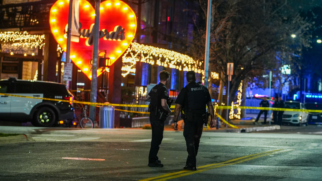 Police officers guard the scene on West 6th Street at West Avenue after a shooting, Sunday March 1, 2026, in Austin, Texas. (Ricardo B. Brazziell/Austin American-Statesman via AP)