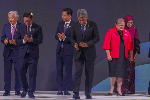 From left, Singapore's Permanent Secretary of Foreign Affairs Albert Chu, Thailand's Foreign Minister Sihasak Phuangketkeow, Vietnam's Deputy Minister of Foreign Affairs Dang Hoang Giang, Malaysia's Foreign Minister Mohamad Hasan, Philippine Foreign Secretary Theresa Lazaro and unidentified Brunei's representative leave after a group photo during ASEAN foreign ministers' meeting at the Kuala Lumpur Convention Centre in Kuala Lumpur, Malaysia, Saturday, Oct. 25, 2025. (AP Photo/Rafiq Maqbool) From left, Singapore's Permanent Secretary of Foreign Affairs Albert Chu, Thailand's Foreign Minister Sihasak Phuangketkeow, Vietnam's Deputy Minister of Foreign Affairs Dang Hoang Giang, Malaysia's Foreign Minister Mohamad Hasan, Philippine Foreign Secretary Theresa Lazaro and unidentified Brunei's representative leave after a group photo during ASEAN foreign ministers' meeting at the Kuala Lumpur Convention Centre in Kuala Lumpur, Malaysia, Saturday, Oct. 25, 2025. (AP Photo/Rafiq Maqbool)