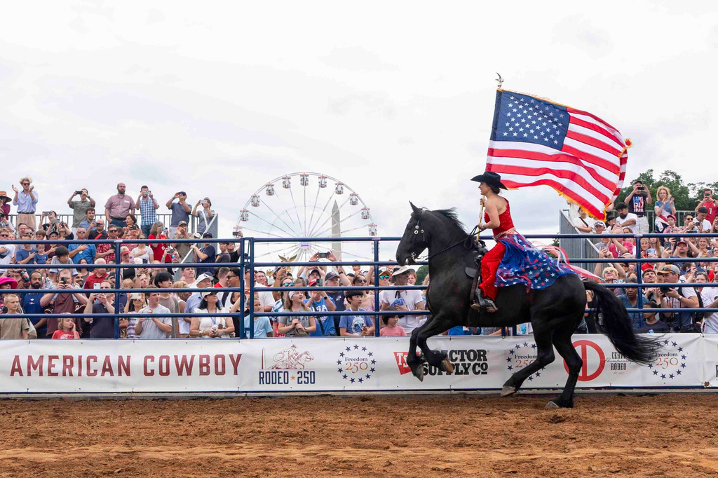People watch Rodeo250 at the Great American State Fair on the National Mall, Saturday, June 27, 2026, in Washington. (AP Photo/Jen Golbeck)