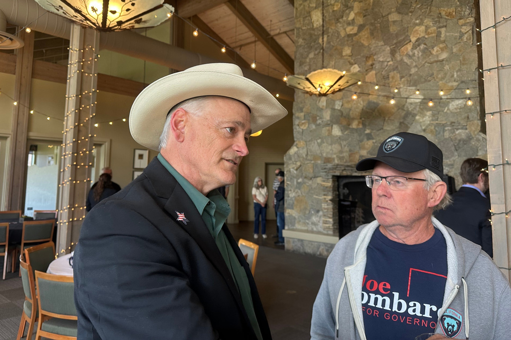James Settelmeyer, left, a Republican candidate for Congress in Nevada's 2nd district, speaks to attendees of a Nevada Builders Alliance event in Washoe Valley, Nev., Wednesday, May 20, 2026. (AP Photo/Jessica Hill)