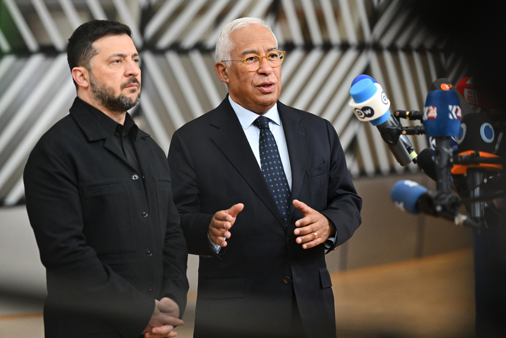 Ukraine's President Volodymyr Zelenskyy, left, and European Council President Antonio Costa speak with the media as they arrive for an EU Summit at the European Council building in Brussels, Thursday, Oct. 23, 2025. (AP Photo/Harry Nakos)