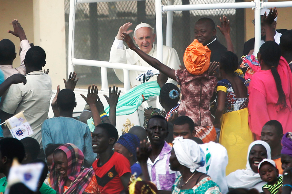FILE - Pope Francis waves to the crowd on the occasion of his visit at the Central Mosque in Bangui's Muslim enclave of PK5, Central African Republic, on Nov. 30, 2015. (AP Photo/Jerome Delay, File)
