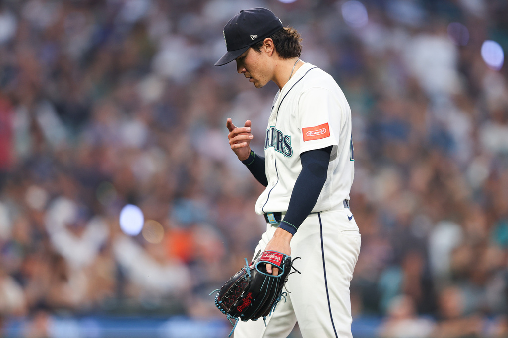 Seattle Mariners pitcher Bryan Woo (22) reacts after the seventh inning of a baseball game against the Detroit Tigers, Wednesday, Aug. 5, 2026, in Seattle. (AP Photo/Kevin Ng)