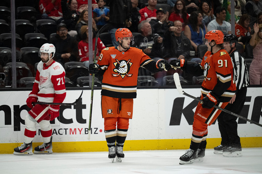 Anaheim Ducks right wing Troy Terry (19) celebrates his empty-net goal with center Leo Carlsson (91) during the third period of an NHL hockey game against the Detroit Red Wings, Friday, Oct. 31, 2025, in Anaheim, Calif. (AP Photo/Kyusung Gong) Anaheim Ducks right wing Troy Terry (19) celebrates his empty-net goal with center Leo Carlsson (91) during the third period of an NHL hockey game against the Detroit Red Wings, Friday, Oct. 31, 2025, in Anaheim, Calif. (AP Photo/Kyusung Gong)