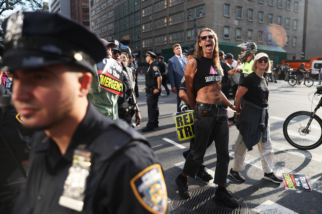 Protesters are detained for attempting to block traffic at the intersection of 42nd street during the 80th session of the United Nations General Assembly in New York, Tuesday, Sept. 23, 2025. (AP Photo/Heather Khalifa)