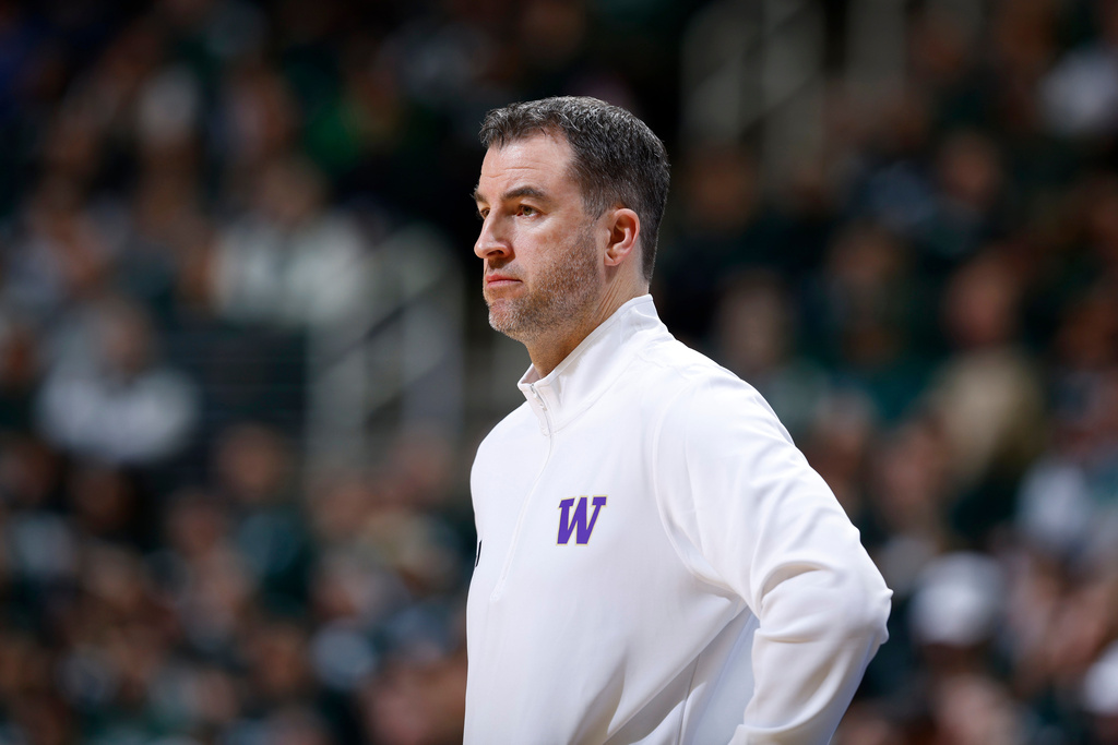 FILE - Washington coach Danny Sprinkle watches during an NCAA college basketball game, Jan. 9, 2025, in East Lansing, Mich. (AP Photo/Al Goldis, File)