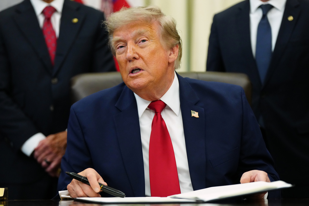 President Donald Trump speaks in the Oval Office of the White House, Monday, July 13, 2026, in Washington, as he signs executive orders. (AP Photo/Julia Demaree Nikhinson)
