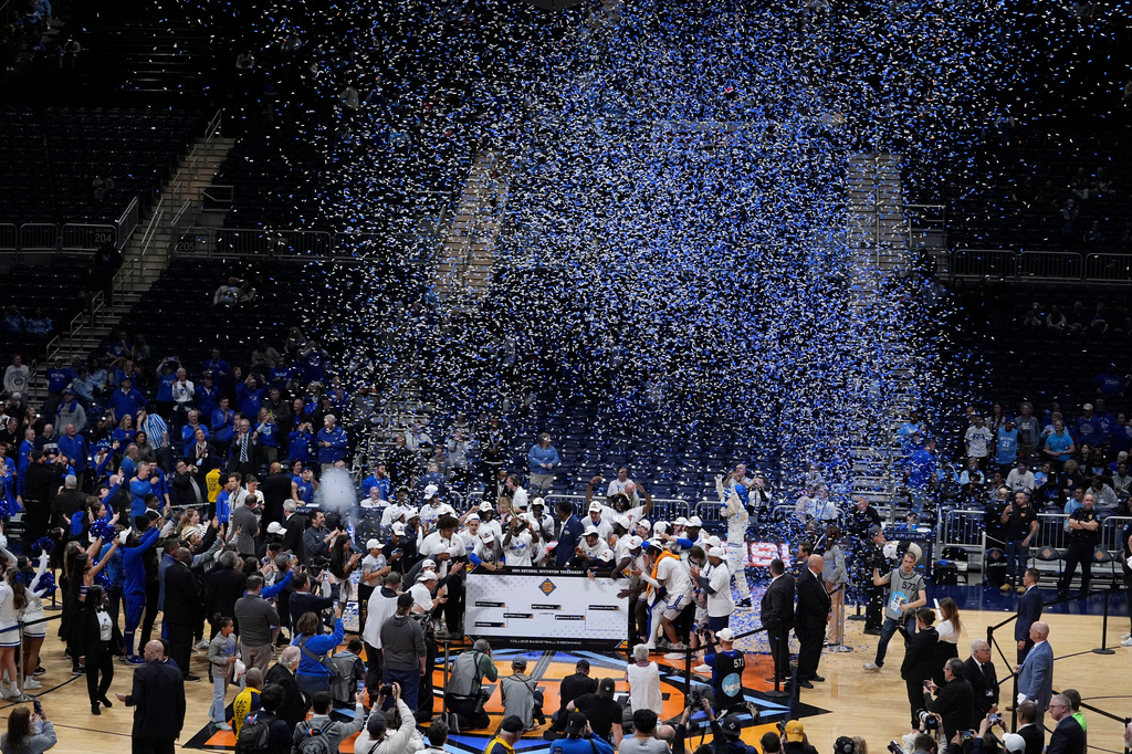 FILE - Seton Hall players celebrate after defeating Indiana State in an NCAA college basketball game for the championship of the NIT, April 4, 2024, in Indianapolis. (AP Photo/Michael Conroy, File)