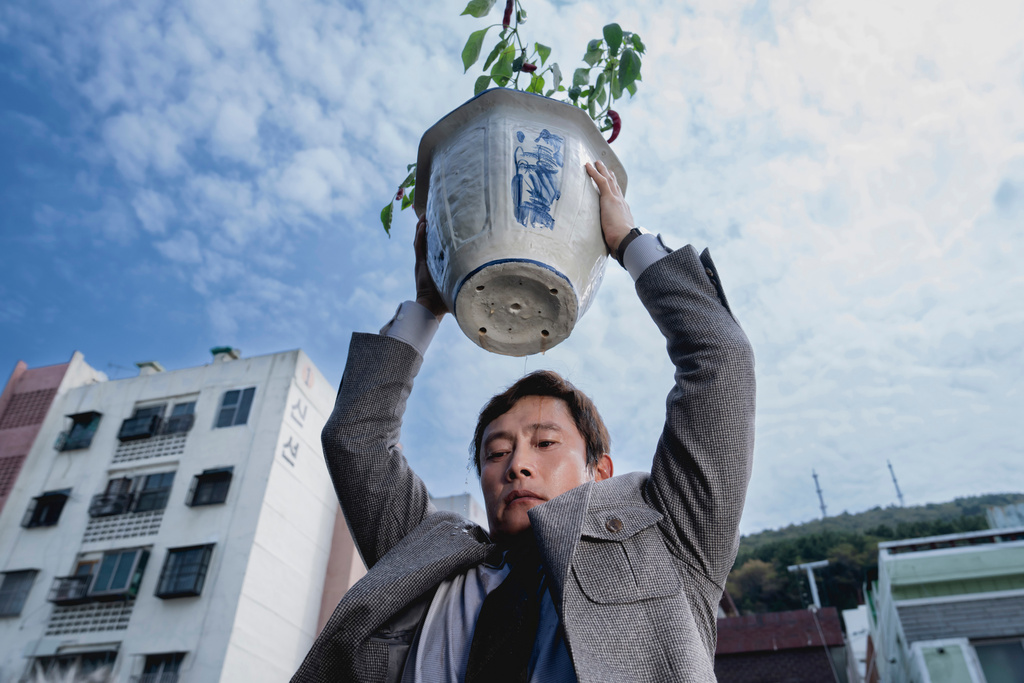This image released by Neon shows Lee Byung-hun in a scene from "No Other Choice." (Neon via AP)
