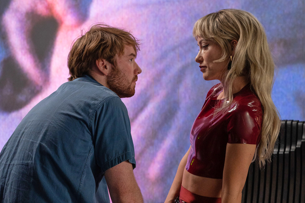 This image released by Magnolia Pictures shows Olivia Wilde, right, and Cooper Hoffman in a scene from "I Want Your Sex." (Magnolia Pictures via AP)