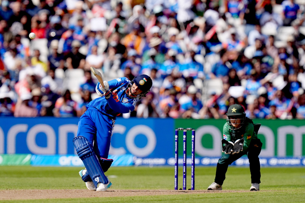 India's Smriti Mandhana is caught out by Pakistan's Fatima Sana during the ICC Women's T20 World Cup, Group 1 cricket match between India and Pakistan in Birmingham, England, Sunday, June 14, 2026. (Jacob King/PA via AP)