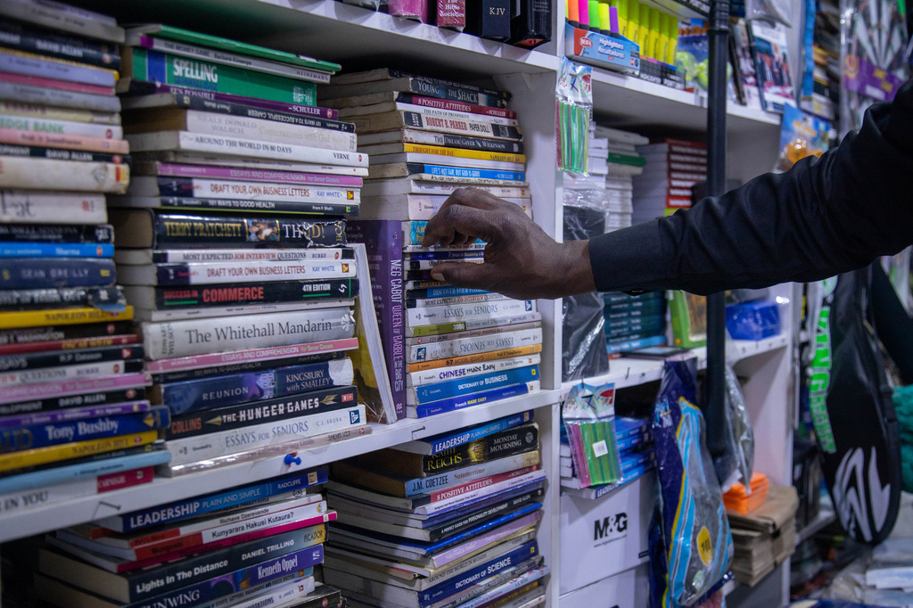 A customer browses for books at a bookstore in Harare, Zimbabwe, Wednesday, Oct. 14, 2026. (AP Photo/Aaron Ufumeli)