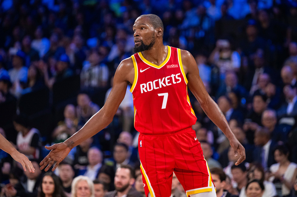 In this photo released by Xinhua News Agency, Amen Thompson of Houston Rockets reacts during a preseason NBA basketball game against the Dallas Mavericks in Macao on Friday, Oct. 9, 2026. (Cheong Kam Ka/Xinhua via AP)
