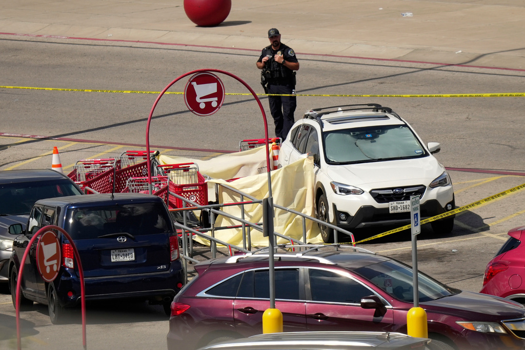 Police work at the scene of a fatal shooting at Target on Research Parkway in Austin, Texas, Monday, Aug. 11, 2025. (Jay Janner/Austin American-Statesman via AP)