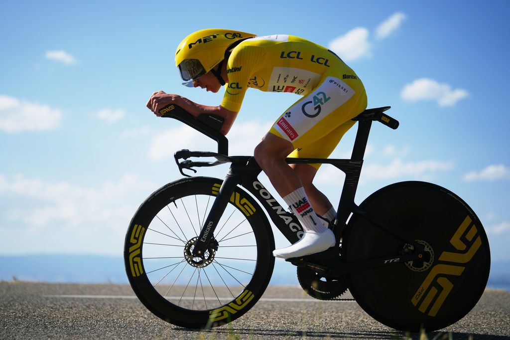 Slovenia's Tadej Pogacar, wearing the overall leader's yellow jersey, rides during the sixteenth stage of the Tour de France cycling race, an indivdual time-trial with start in Evian-Les-Bains and finish in Thonon-les-Bains, France, Tuesday, July 21, 2026. (AP Photo/Thibault Camus)