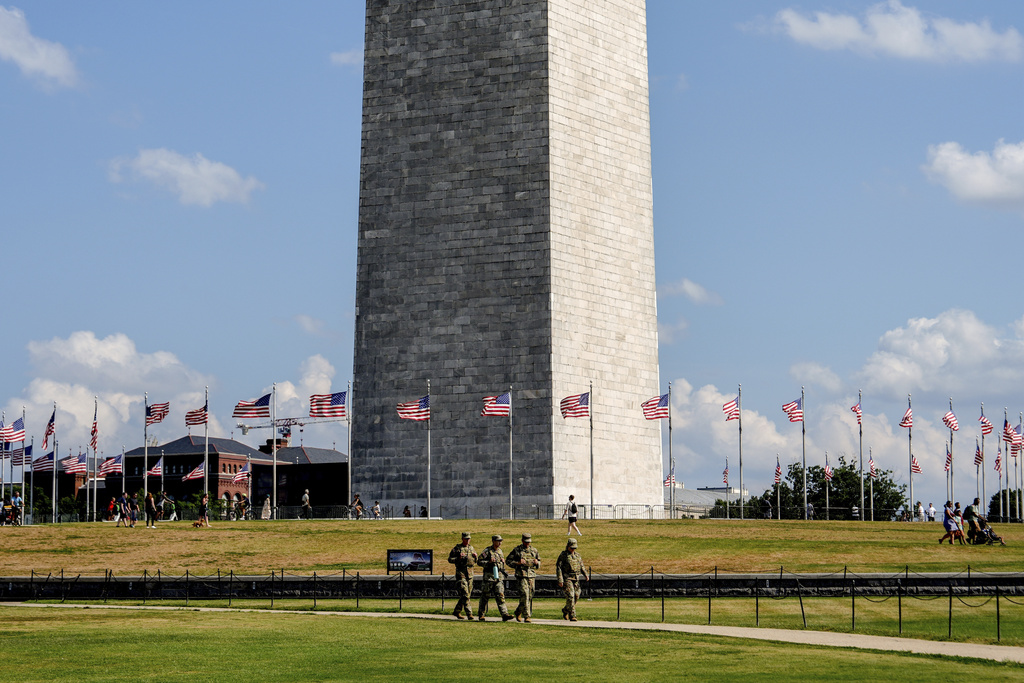 Members of the District of Columbia National Guard patrol along the National Mall, Saturday, Aug. 16, 2025, in Washington. (AP Photo/Julia Demaree Nikhinson)