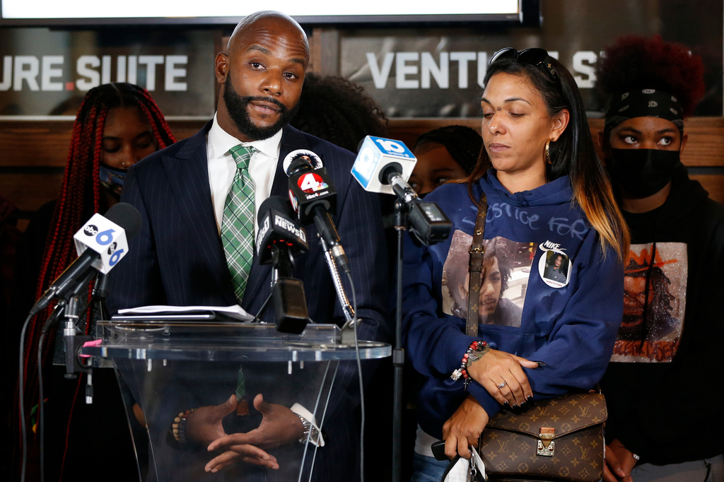 FILE - Sean Walton, left, attorney representing Tamala Payne, right, the mother of Casey Goodson Jr., speaks during a news conferenc, Dec. 2, 2021, in Columbus, Ohio. (AP Photo/Jay LaPrete)