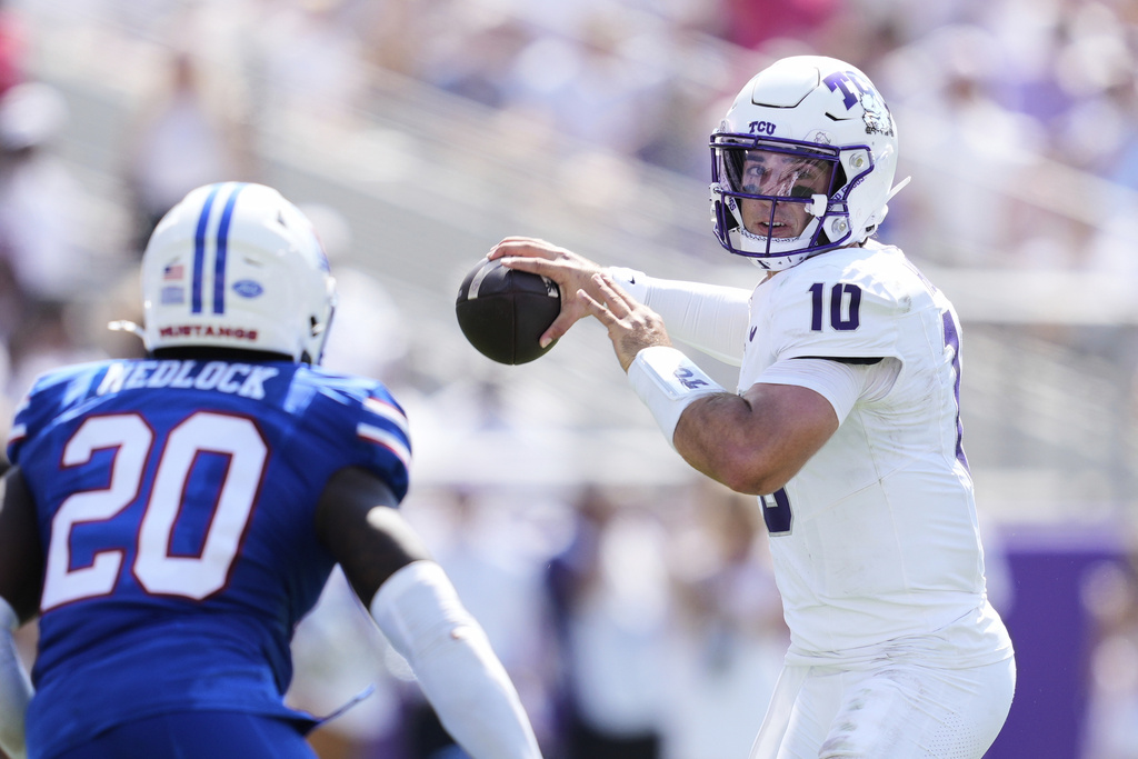 TCU quarterback Josh Hoover (10) throws a pass under pressure from SMU linebacker Justin Medlock (20) in the first half of an NCAA college football game, Saturday, Sept. 20, 2025, in Fort Worth, Texas. (AP Photo/Tony Gutierrez)