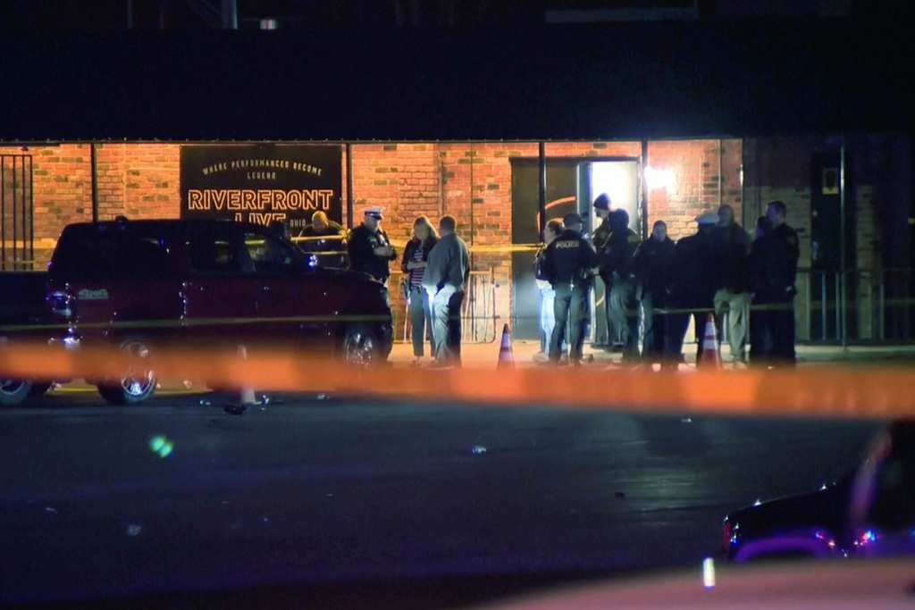 This image taken from video taken provided by WCPO shows first responders outside of Riverfront Live on Sunday, March 1, 2026, in Cincinnati, Ohio. (WCPO via AP)