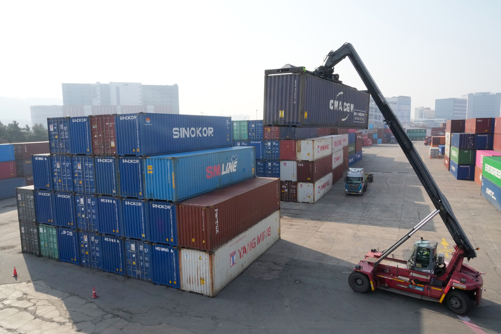 A crane unloads a container at the Uiwang ICD Terminal in Uiwang, South Korea, Thursday, March 12, 2026. (AP Photo/Ahn Young-joon)