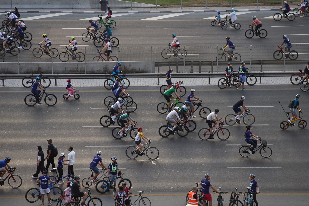 Bicyclists ride along Sheikh Zayed highway during the Dubai Ride annual event in Dubai, United Arab Emirates, Sunday, Nov. 2, 2025. (AP Photo/ Fatima Shbair)