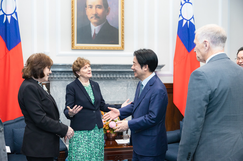 In this photo, released by the Taiwan Presidential Office, Taiwan's President William Lai Ching-te, greets visiting U.S. lawmakers including US Sen. Jeanne Shaheen, second from left and Jacky Rosen, left, in Taipei, Taiwan, Monday, March 30, 2026. (Taiwan Presidential Office via AP)