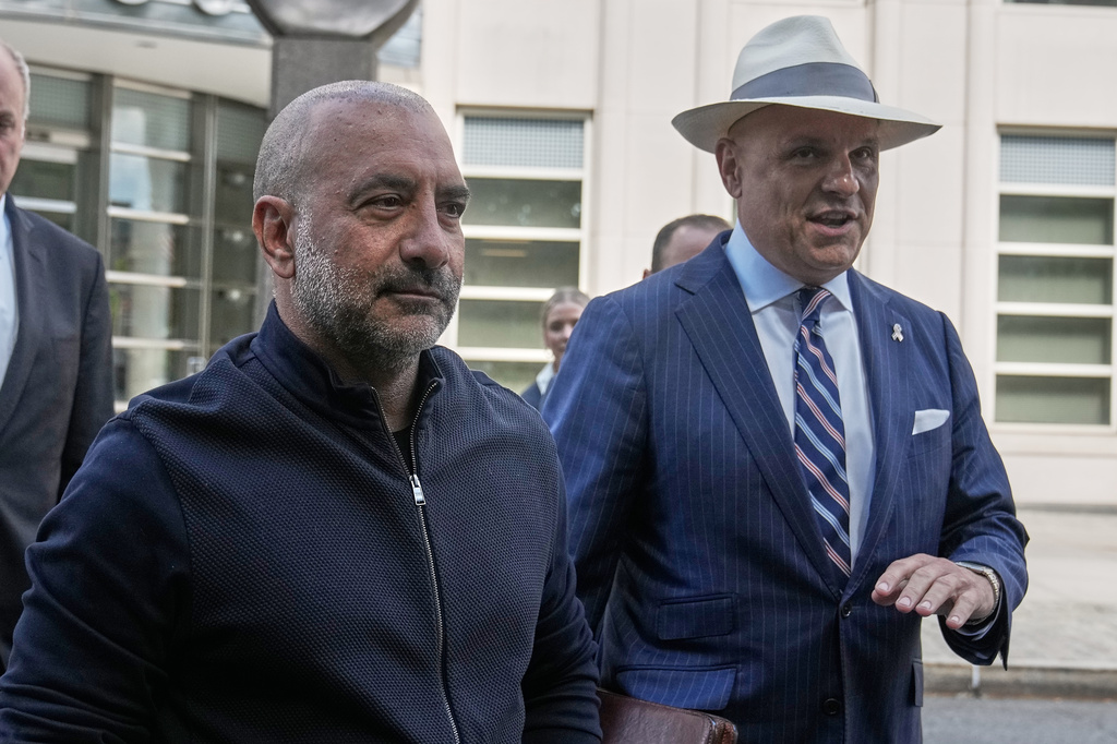 Frank Carone, left, accompanied by his lawyer Arthur Aidala, leaves federal court in the Brooklyn borough of New York, Wednesday, June 24, 2026. (AP Photo/Richard Drew)